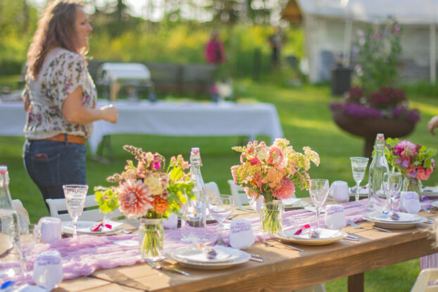 Farm table adorned with DIY floral arrangements