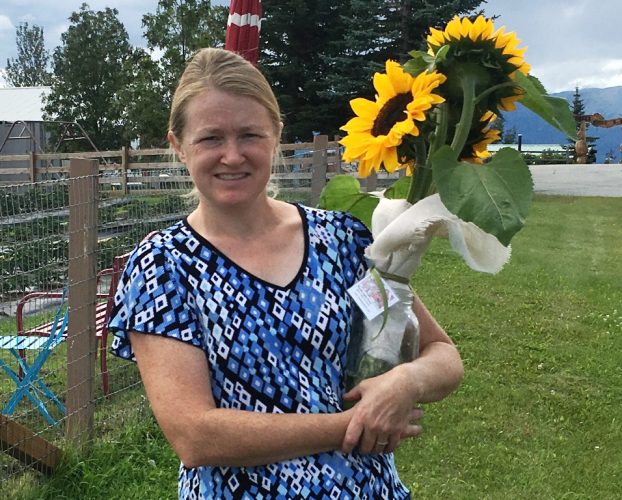 Kelly Dellan of Wasilla Lights Farm, with her sunflower crop